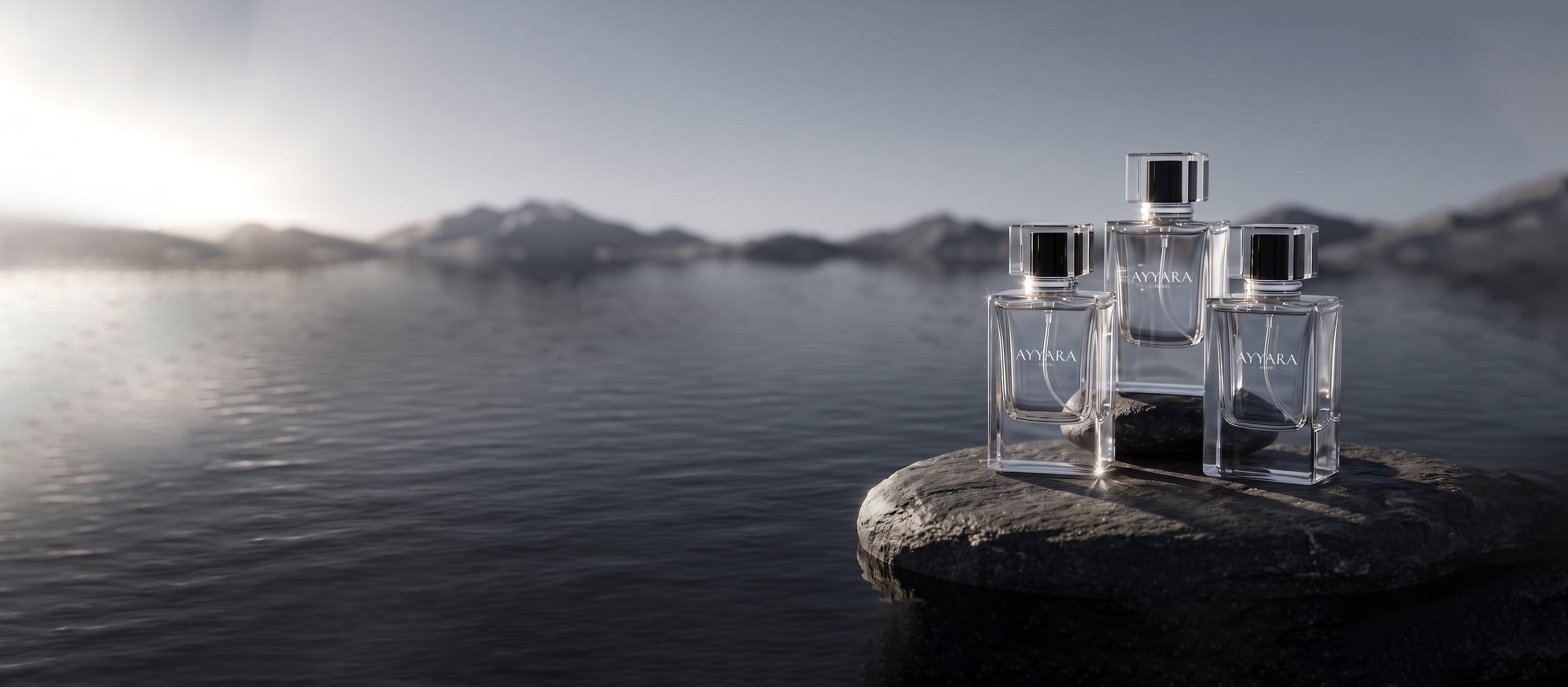 Three Ayyara Rebirth bottles on a stone at the edge of a calm lake